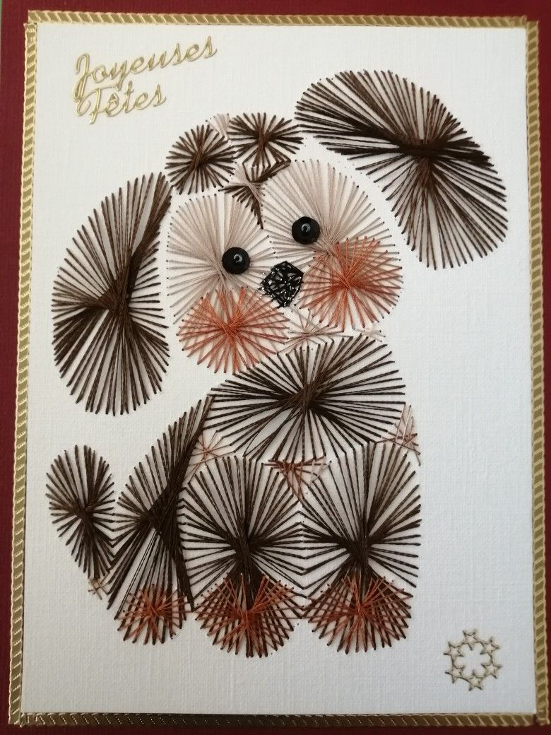 Chien brodé sur papier avec l'inscription Joyeuses Fêtes